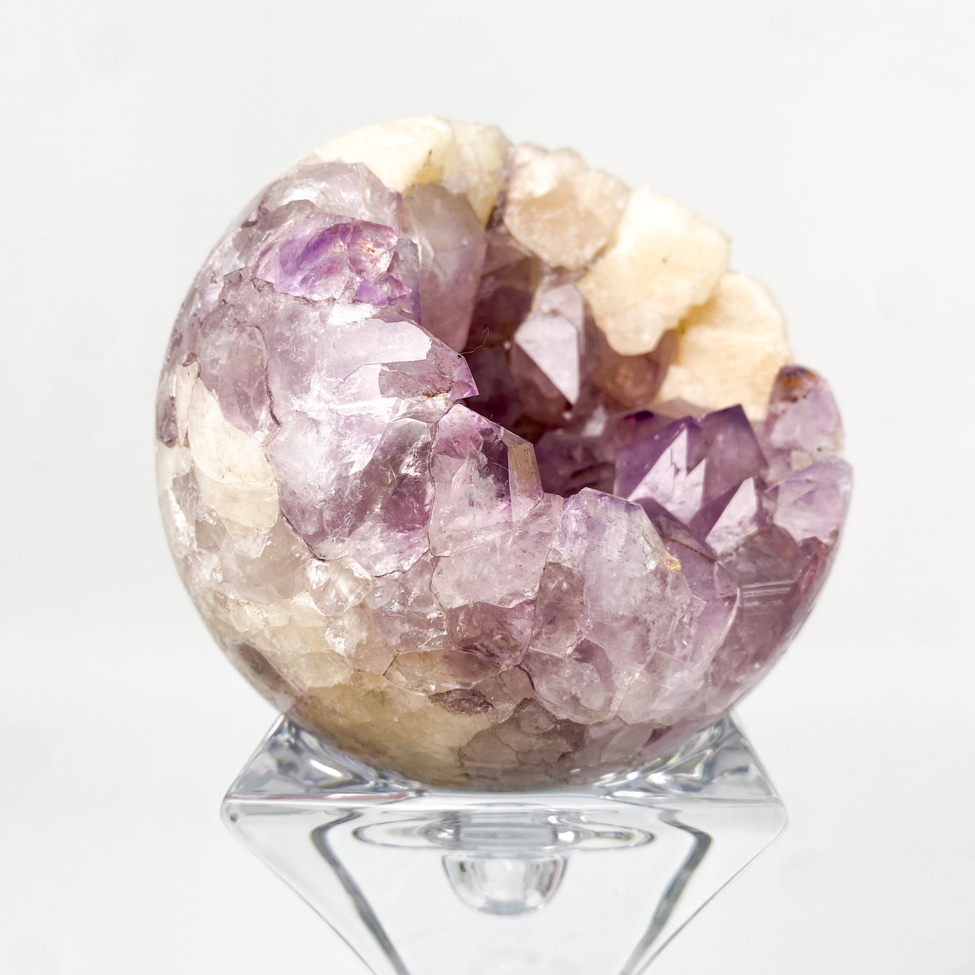 Amethyst sphere with Calcite inclusion
