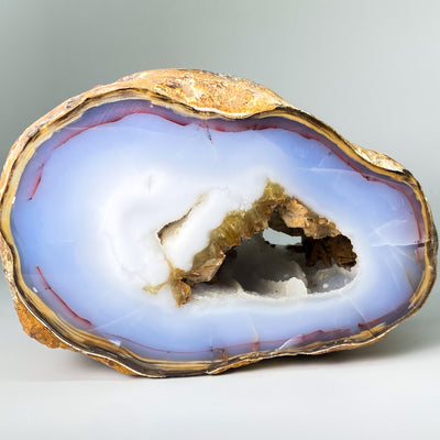 Blue Chalcedony geode with Desert Rose and Hematite inclusions